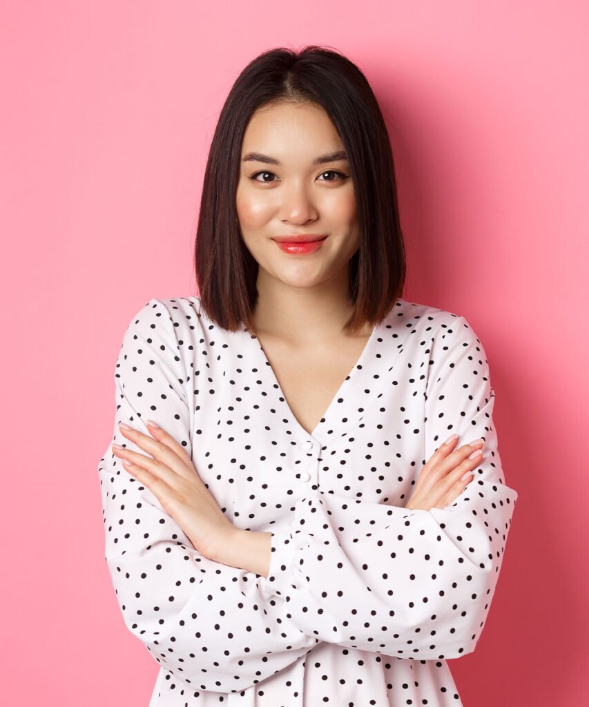 beautiful asian female model standing in dress cr EDULG5G - About