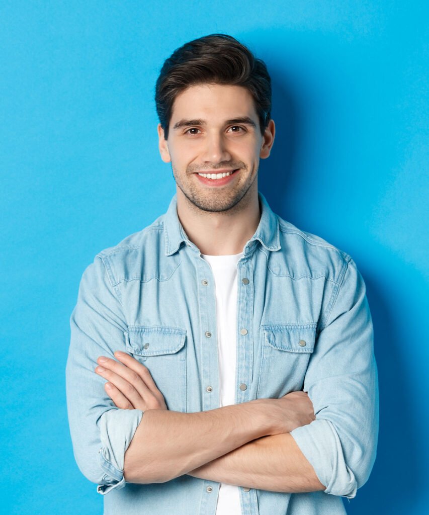 handsome guy in casual clothes standing with arms HWSQN2E - About